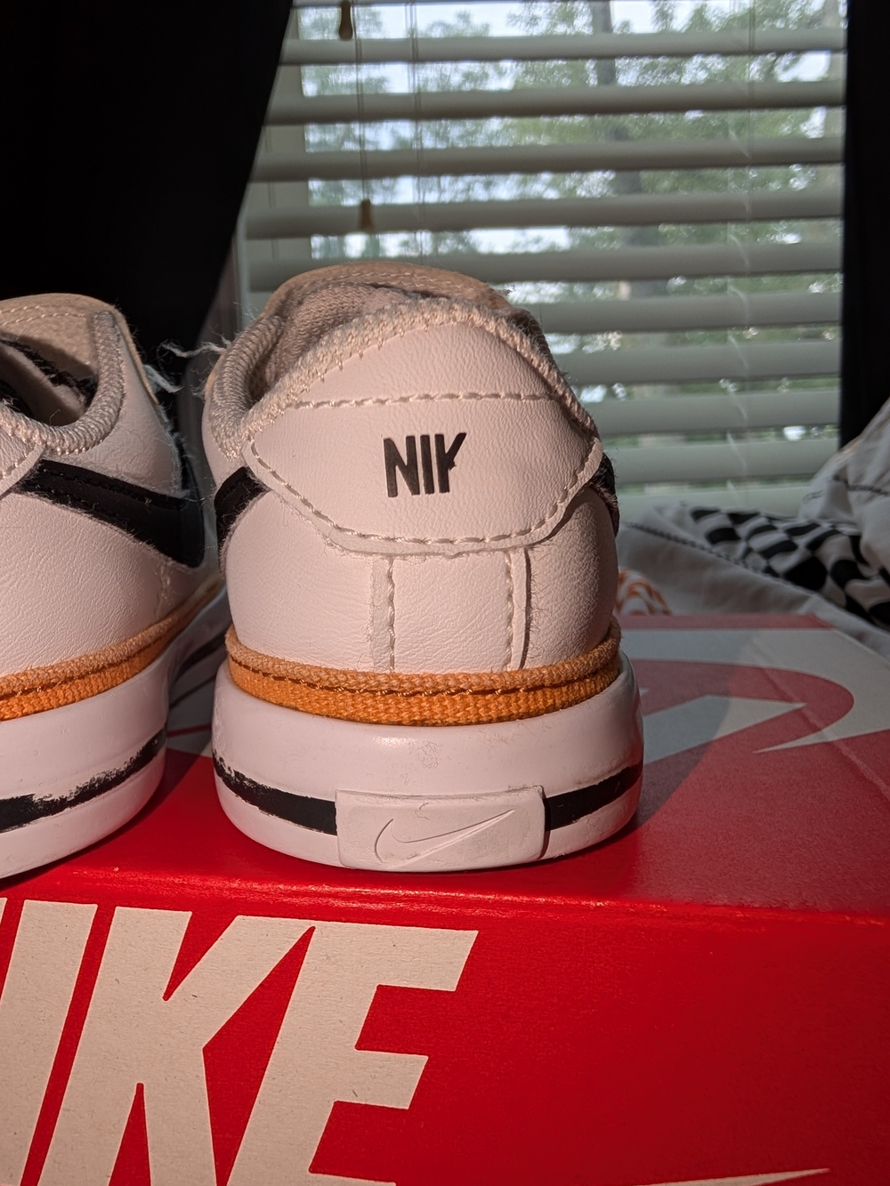 Nike Kids White Sneaker with Black Swoosh and Orange Trim - Picture 6 of 6